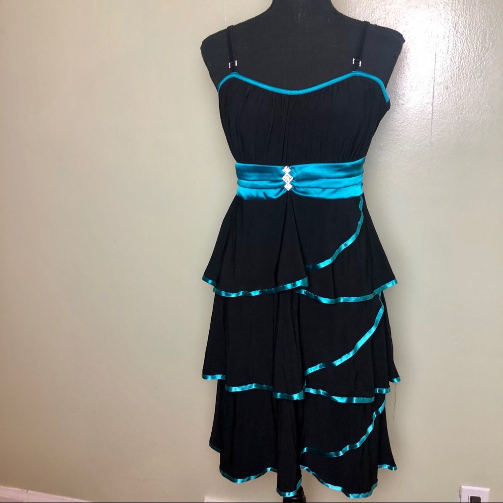 Black and blue party dress with ruffles and gems